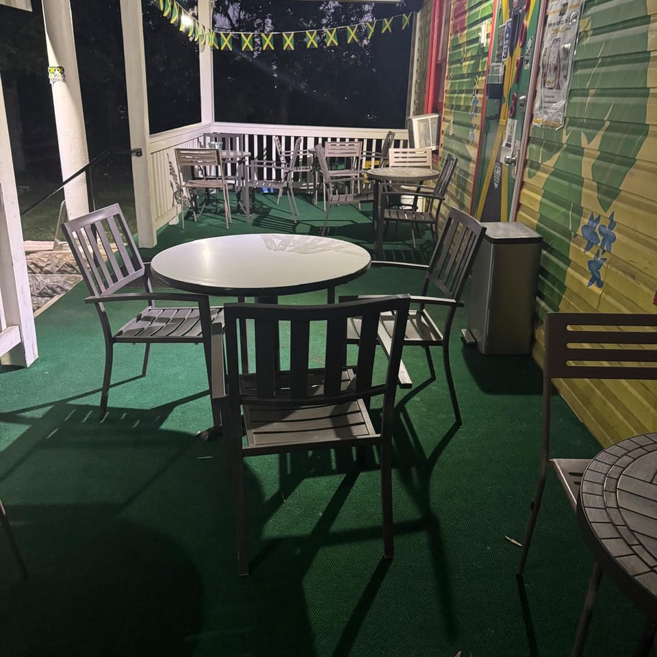 Outdoor patio dining at The Jerk Pit